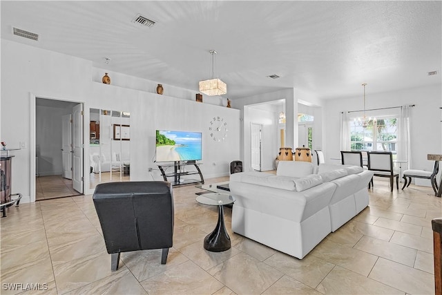 living room with an inviting chandelier