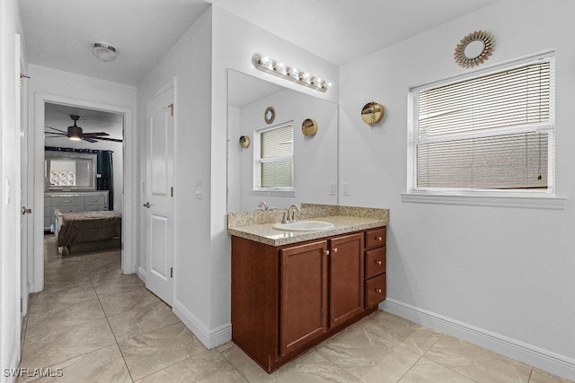 bathroom with ceiling fan and vanity