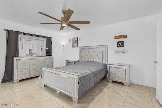 bedroom with ceiling fan and light tile patterned flooring