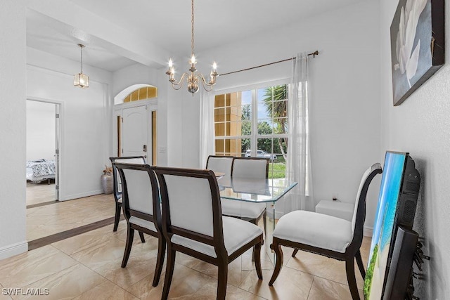 dining room with a notable chandelier