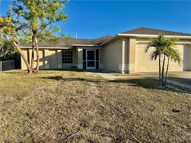 view of home's exterior with a garage and a lawn