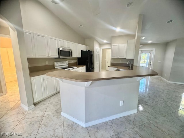 kitchen featuring kitchen peninsula, black refrigerator, vaulted ceiling, white electric stove, and white cabinets