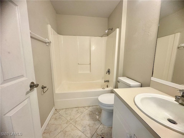 full bathroom featuring toilet, vanity, and washtub / shower combination