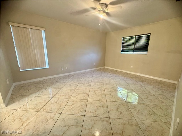 unfurnished room featuring ceiling fan