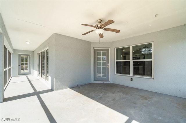 view of patio featuring ceiling fan