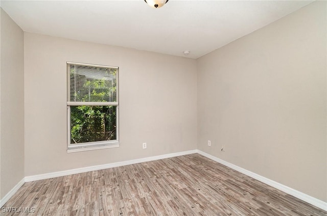 unfurnished room featuring light wood-type flooring