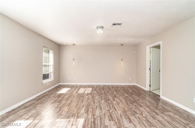 empty room featuring hardwood / wood-style flooring