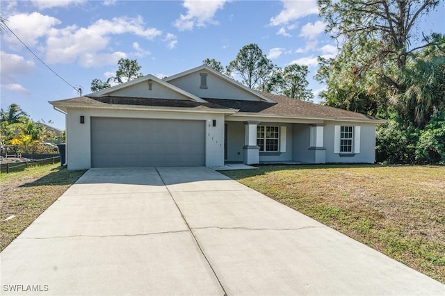 ranch-style home featuring a garage and a front lawn