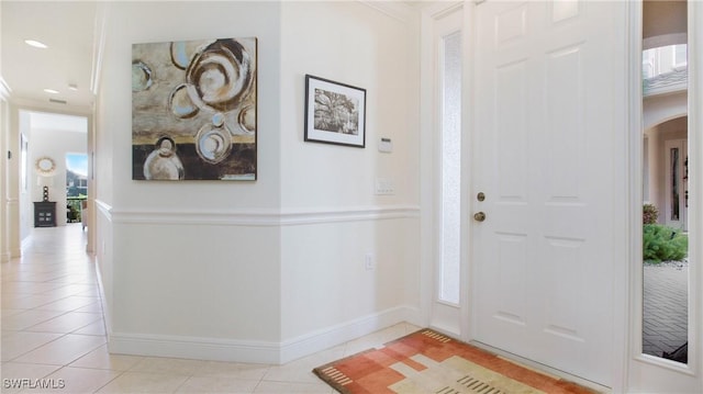 tiled entryway with plenty of natural light