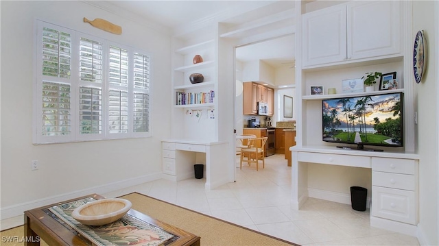 interior space with built in shelves, light tile patterned floors, and ornamental molding