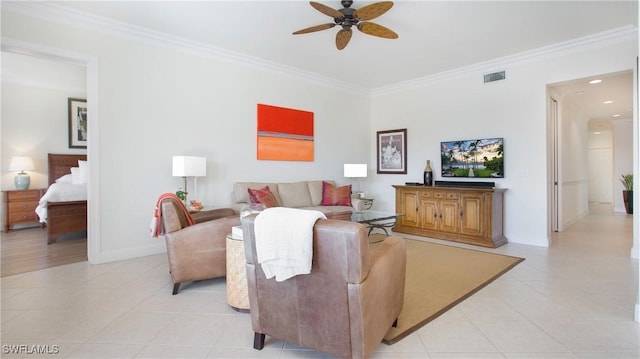 living room with ceiling fan, light tile patterned floors, and ornamental molding