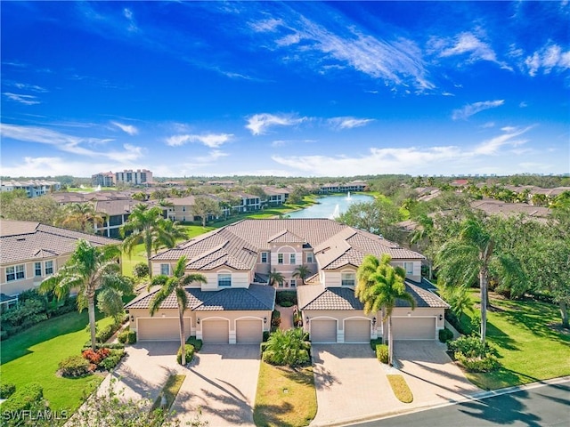 drone / aerial view with a water view