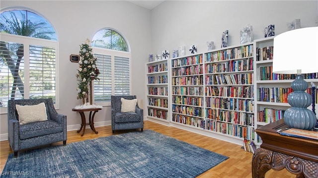 sitting room with hardwood / wood-style floors