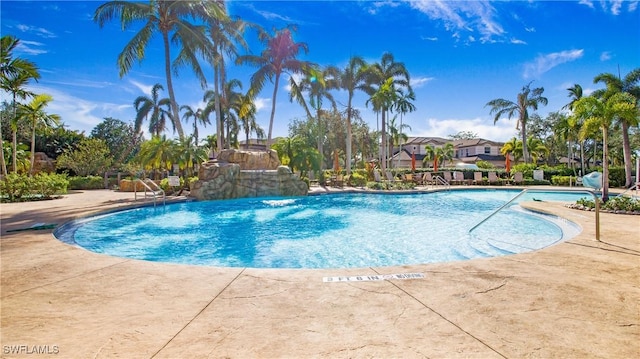 view of pool with pool water feature and a patio area