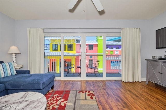 living room with ceiling fan and hardwood / wood-style floors