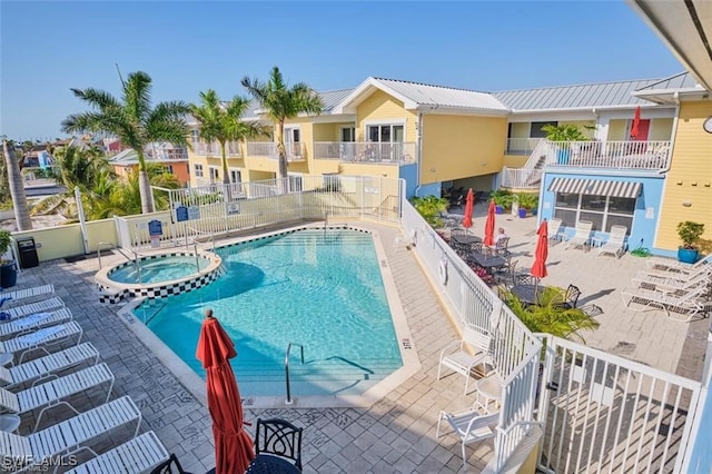 view of swimming pool with a patio area