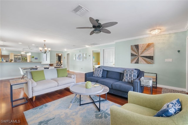 living room with ceiling fan with notable chandelier, dark hardwood / wood-style flooring, and crown molding