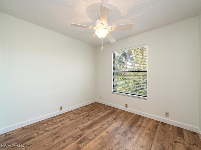 empty room with wood-type flooring, a textured ceiling, and ceiling fan