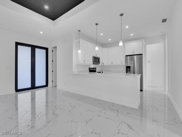 kitchen featuring visible vents, french doors, stainless steel appliances, a peninsula, and white cabinetry