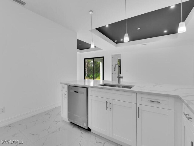 kitchen featuring a sink, a tray ceiling, white cabinetry, light stone countertops, and dishwasher