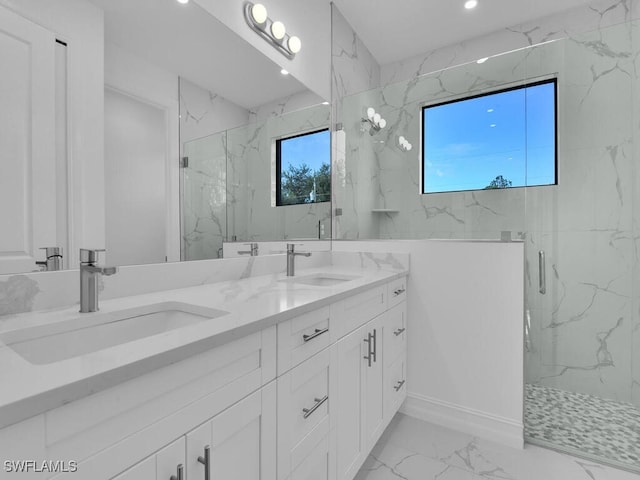 full bathroom with marble finish floor, a marble finish shower, and a sink