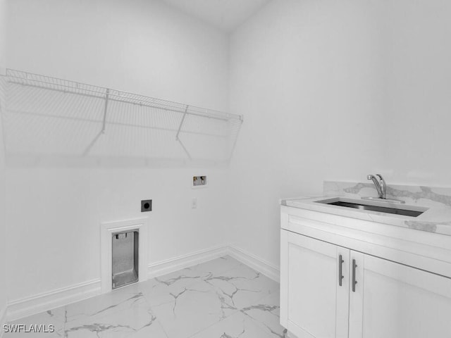 washroom with electric dryer hookup, marble finish floor, washer hookup, a sink, and baseboards