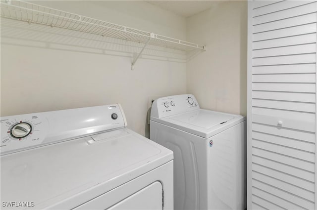 laundry area with washer and clothes dryer