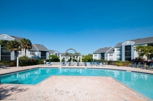 view of swimming pool with a patio