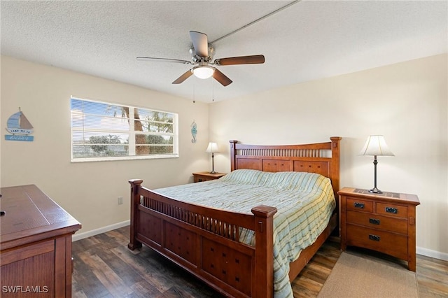 bedroom featuring a textured ceiling, dark hardwood / wood-style flooring, and ceiling fan