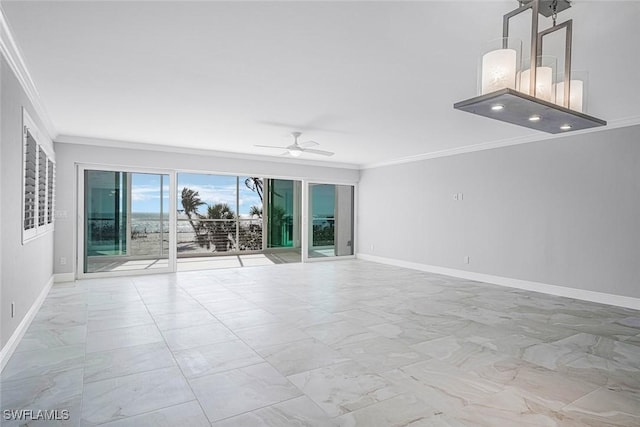 unfurnished room featuring ceiling fan and crown molding