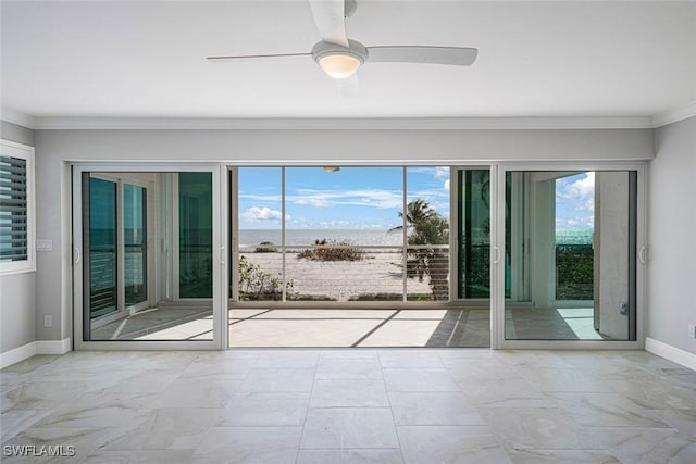 doorway to outside featuring crown molding and ceiling fan