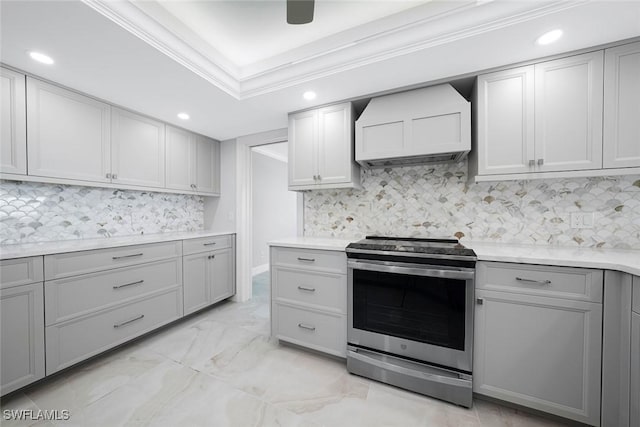 kitchen with gray cabinetry, backsplash, crown molding, electric stove, and custom range hood