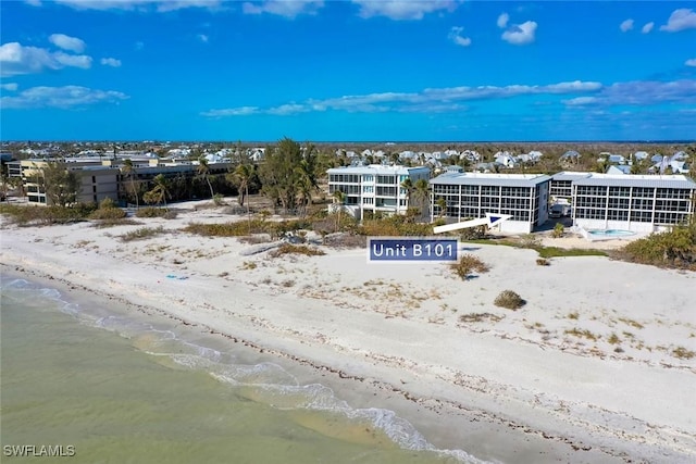 drone / aerial view with a view of the beach and a water view