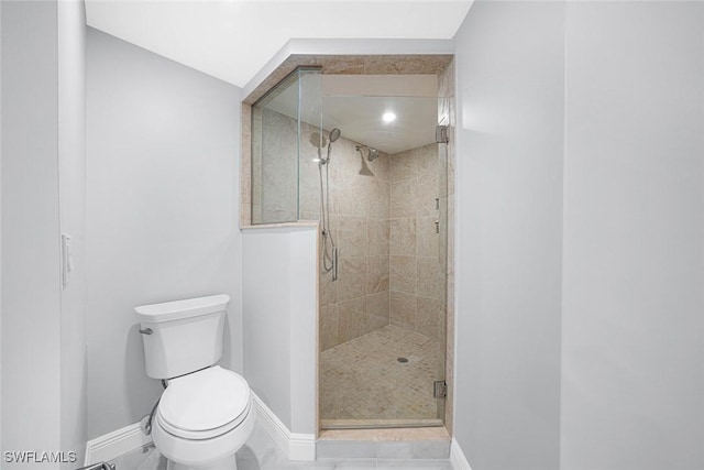 bathroom featuring toilet and walk in shower