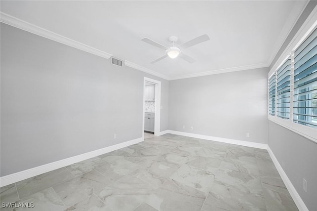 unfurnished room with ceiling fan and ornamental molding