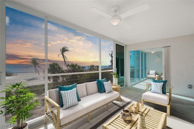 sunroom featuring ceiling fan