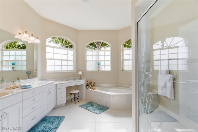 bathroom with vanity, tile patterned floors, and separate shower and tub