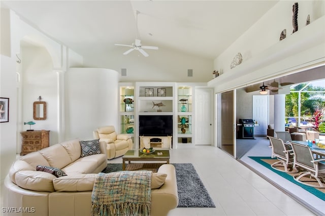 living room featuring high vaulted ceiling