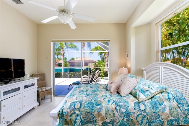 bedroom with access to outside, ceiling fan, and light tile patterned floors