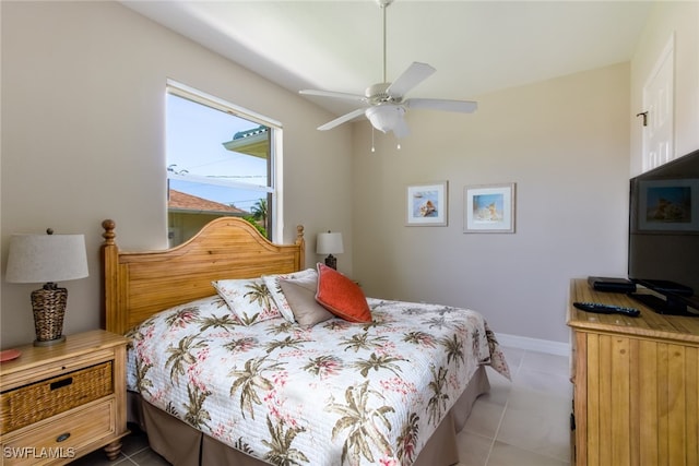 bedroom featuring tile patterned floors and ceiling fan