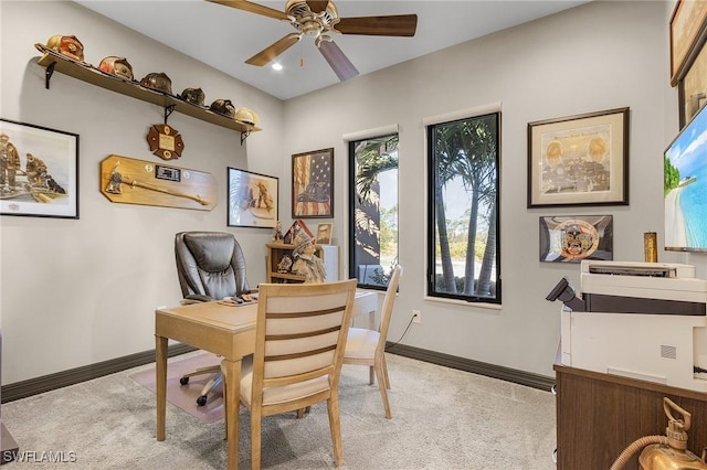 office space with ceiling fan and light colored carpet