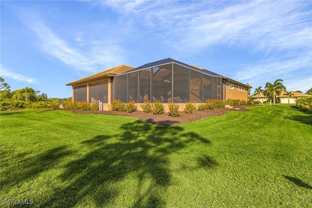 rear view of house featuring a yard