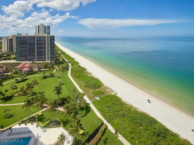 drone / aerial view featuring a view of the beach and a water view