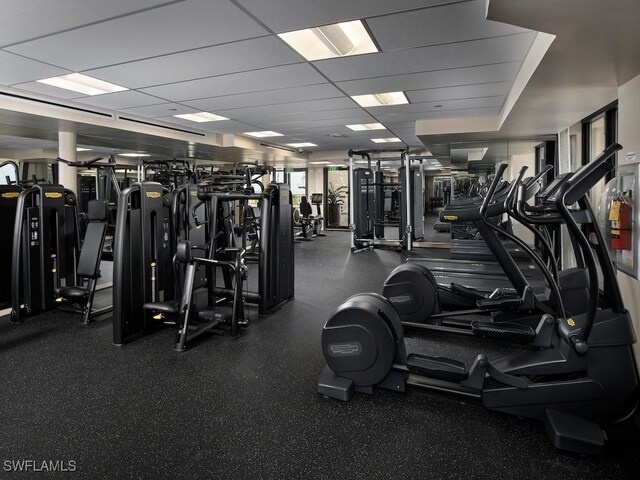 exercise room featuring a drop ceiling