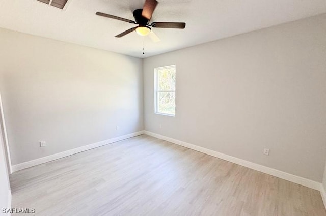 empty room featuring ceiling fan and light wood-type flooring