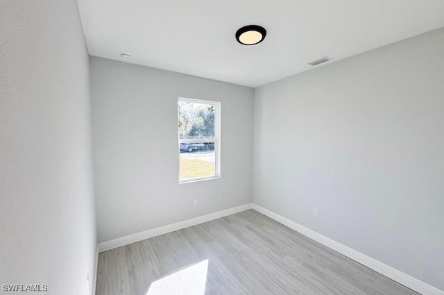 unfurnished room with light hardwood / wood-style floors