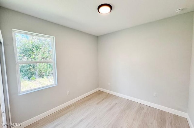 unfurnished room with light hardwood / wood-style floors