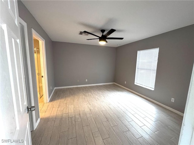 unfurnished room with light hardwood / wood-style flooring and ceiling fan