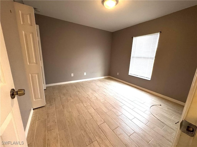 empty room with light wood-type flooring