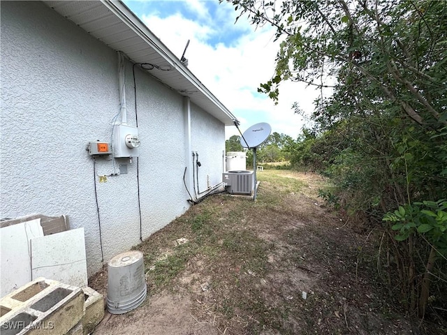 view of property exterior with cooling unit